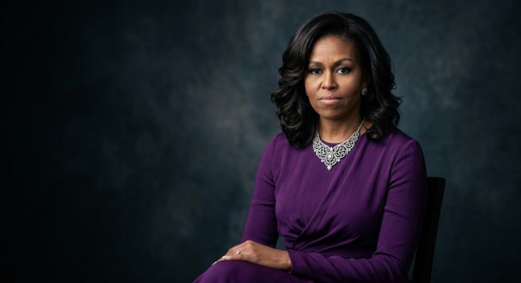 A formal, elegant portrait of former First Lady Michelle Obama in a purple dress.